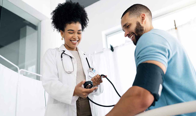 Doctor and patient smiling together, illustrating SLB-biometrics healthcare interaction