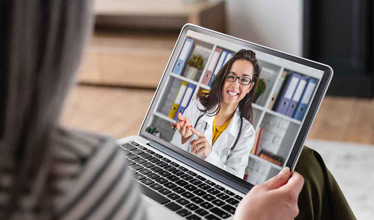 Woman on a video call with a doctor, representing virtual healthcare