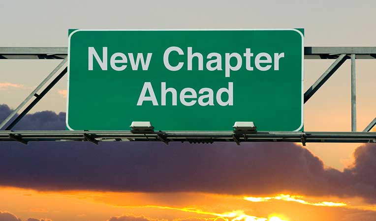 Signboard with the words 'New Chapter Ahead' written on i