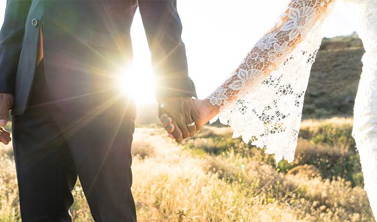 A couple holding hand